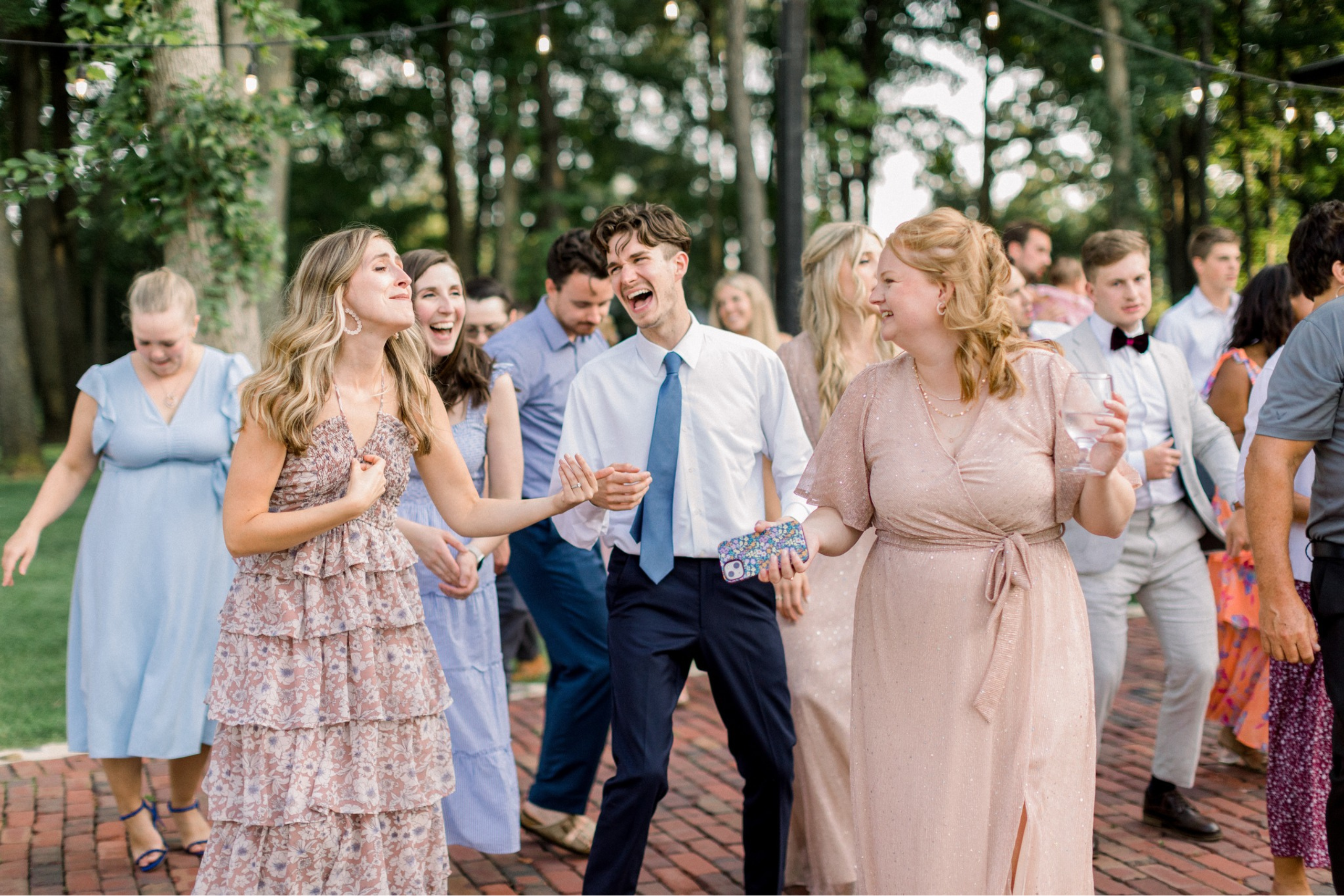 SolomonFowlerGuests Outdoor reception at Solomon Fowler Mansion showing guests dancing, laughing, and smiling